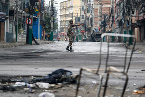 An army soldier patrols the streets after the Gen Z protests in Kathmandu, Nepal, on Wednesday, September 10, 2025, the third day of an army-imposed curfew. The demonstrations, sparked by anger over corruption, the social media ban, and the killing of more than 19 youths, led to the resignation of Prime Minister K.P. Sharma Oli. The country remains under army control amid escalating unrest.