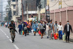 Prisoners are escorted back to jail after attempting to escape by setting the facility on fire after the Gen Z protests in Kathmandu, Nepal, on Wednesday, September 10, 2025, the third day of an army-imposed curfew. The demonstrations, sparked by anger over corruption, the social media ban, and the killing of more than 19 youths, led to the resignation of Prime Minister K.P. Sharma Oli. The country remains under army control amid escalating unrest.