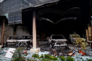 Burnt vehicles are seen inside the showroom after the Gen Z protests in Kathmandu, Nepal, on Wednesday, September 10, 2025, the third day of an army-imposed curfew. The demonstrations, sparked by anger over corruption, the social media ban, and the killing of more than 19 youths, led to the resignation of Prime Minister K.P. Sharma Oli. The country remains under army control amid escalating unrest.