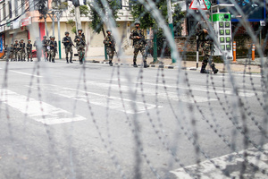 Nepal Army patrol the streets after the Gen Z protests in Kathmandu, Nepal, on Wednesday, September 10, 2025, the third day of an army-imposed curfew. The demonstrations, sparked by anger over corruption, the social media ban, and the killing of more than 19 youths, led to the resignation of Prime Minister K.P. Sharma Oli. The country remains under army control amid escalating unrest.