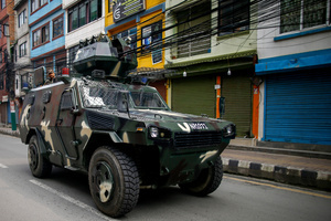 An army military vehicle patrols the streets following the Gen Z protests in Kathmandu, Nepal, on Wednesday, September 10, 2025, the third day of an army-imposed curfew. The demonstrations, fueled by anger over corruption, the social media ban, and the killing of more than 19 youths, forced Prime Minister K.P. Sharma Oli to resign. The country remains under army control amid ongoing unrest.