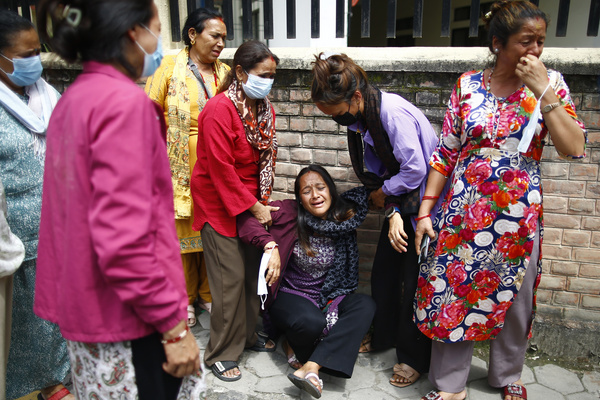 A woman mourns the death of her relative, 24-year-old Yogendra Neupane who was killed during the protests in. The death toll from the Gen Z protests in Nepal has risen to 51, with 30 killed by gunshots and 21 from other injuries, according to the Ministry of Health and Population. The protests, fueled by anger over corruption, a social media ban, and the killing of 30 youths, forced Prime Minister K.P. Sharma Oli to resign. Neupane was among those killed during the fifth day of an army-imposed curfew, though the exact cause of his death remains unclear.