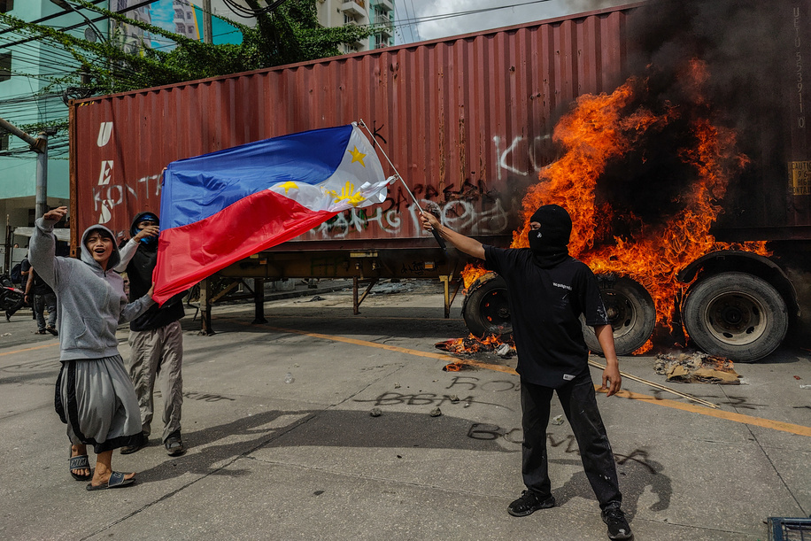 Gen Z activist waves a flag during the demonstration. The 