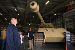 A spectator is seen inspecting a German King Tiger tank. The Tank Museum's Tiger Day is a biannually event at Bovington camp showcasing German Tiger 131, the only operational Tiger I tank in the world, it also features other World War II-era tanks including M4A2E8 Sherman "Fury", M3 Grant and the British Churchill tank. The event included a reenactment of the Battle of "Capture the Tiger", demonstrating how the Tiger 131 was captured on 24th April 1943 in Tunisia by 42nd Battalion Royal Armored Corps and 2nd Sherwood Foresters.