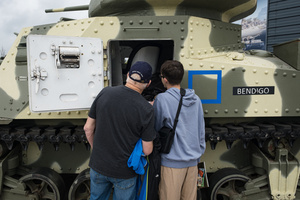 Spectators are seen inspecting the interior of a M3 Grant tank. The Tank Museum's Tiger Day is a biannually event at Bovington camp showcasing German Tiger 131, the only operational Tiger I tank in the world, it also features other World War II-era tanks including M4A2E8 Sherman "Fury", M3 Grant and the British Churchill tank. The event included a reenactment of the Battle of "Capture the Tiger", demonstrating how the Tiger 131 was captured on 24th April 1943 in Tunisia by 42nd Battalion Royal Armored Corps and 2nd Sherwood Foresters.