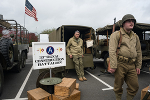 The showcase booth of a WWII US Army reenactment group. The Tank Museum's Tiger Day is a biannually event at Bovington camp showcasing German Tiger 131, the only operational Tiger I tank in the world, it also features other World War II-era tanks including M4A2E8 Sherman "Fury", M3 Grant and the British Churchill tank. The event included a reenactment of the Battle of "Capture the Tiger", demonstrating how the Tiger 131 was captured on 24th April 1943 in Tunisia by 42nd Battalion Royal Armored Corps and 2nd Sherwood Foresters.