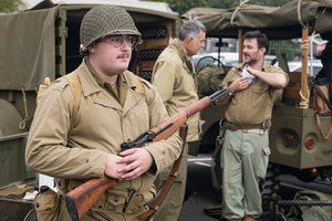 A group of WWII US Army reenactors seen during the event. The Tank Museum's Tiger Day is a biannually event at Bovington camp showcasing German Tiger 131, the only operational Tiger I tank in the world, it also features other World War II-era tanks including M4A2E8 Sherman "Fury", M3 Grant and the British Churchill tank. The event included a reenactment of the Battle of "Capture the Tiger", demonstrating how the Tiger 131 was captured on 24th April 1943 in Tunisia by 42nd Battalion Royal Armored Corps and 2nd Sherwood Foresters.