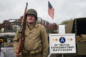 A World War II US Army reenactor poses for a photo during the event. The Tank Museum's Tiger Day is a biannually event at Bovington camp showcasing German Tiger 131, the only operational Tiger I tank in the world, it also features other World War II-era tanks including M4A2E8 Sherman "Fury", M3 Grant and the British Churchill tank. The event included a reenactment of the Battle of "Capture the Tiger", demonstrating how the Tiger 131 was captured on 24th April 1943 in Tunisia by 42nd Battalion Royal Armored Corps and 2nd Sherwood Foresters.