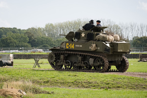 The running M5A1 Stuart tank seen during the showcase in the arena. The Tank Museum's Tiger Day is a biannually event at Bovington camp showcasing German Tiger 131, the only operational Tiger I tank in the world, it also features other World War II-era tanks including M4A2E8 Sherman "Fury", M3 Grant and the British Churchill tank. The event included a reenactment of the Battle of "Capture the Tiger", demonstrating how the Tiger 131 was captured on 24th April 1943 in Tunisia by 42nd Battalion Royal Armored Corps and 2nd Sherwood Foresters.