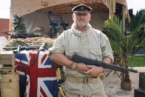 A WWII-era Special Air Service(S.A.S) reenactor pose for a photo during the event. The Tank Museum's Tiger Day is a biannually event at Bovington camp showcasing German Tiger 131, the only operational Tiger I tank in the world, it also features other World War II-era tanks including M4A2E8 Sherman "Fury", M3 Grant and the British Churchill tank. The event included a reenactment of the Battle of "Capture the Tiger", demonstrating how the Tiger 131 was captured on 24th April 1943 in Tunisia by 42nd Battalion Royal Armored Corps and 2nd Sherwood Foresters.