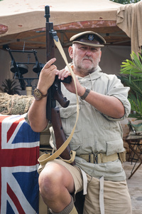 A WWII-era Special Air Service(S.A.S) reenactor pose for a photo during the event. The Tank Museum's Tiger Day is a biannually event at Bovington camp showcasing German Tiger 131, the only operational Tiger I tank in the world, it also features other World War II-era tanks including M4A2E8 Sherman "Fury", M3 Grant and the British Churchill tank. The event included a reenactment of the Battle of "Capture the Tiger", demonstrating how the Tiger 131 was captured on 24th April 1943 in Tunisia by 42nd Battalion Royal Armored Corps and 2nd Sherwood Foresters.