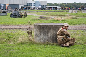 A British soldier takes cover behind a cover during the Battle of "Capture the Tiger" reenactment. The Tank Museum's Tiger Day is a biannually event at Bovington camp showcasing German Tiger 131, the only operational Tiger I tank in the world, it also features other World War II-era tanks including M4A2E8 Sherman "Fury", M3 Grant and the British Churchill tank. The event included a reenactment of the Battle of "Capture the Tiger", demonstrating how the Tiger 131 was captured on 24th April 1943 in Tunisia by 42nd Battalion Royal Armored Corps and 2nd Sherwood Foresters.