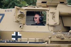 The tank driver looks on in a Panzer III tank. The Tank Museum's Tiger Day is a biannually event at Bovington camp showcasing German Tiger 131, the only operational Tiger I tank in the world, it also features other World War II-era tanks including M4A2E8 Sherman "Fury", M3 Grant and the British Churchill tank. The event included a reenactment of the Battle of "Capture the Tiger", demonstrating how the Tiger 131 was captured on 24th April 1943 in Tunisia by 42nd Battalion Royal Armored Corps and 2nd Sherwood Foresters.