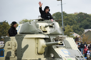 The tank crews in a M3 Grant tank wave at the spectators. The Tank Museum's Tiger Day is a biannually event at Bovington camp showcasing German Tiger 131, the only operational Tiger I tank in the world, it also features other World War II-era tanks including M4A2E8 Sherman "Fury", M3 Grant and the British Churchill tank. The event included a reenactment of the Battle of "Capture the Tiger", demonstrating how the Tiger 131 was captured on 24th April 1943 in Tunisia by 42nd Battalion Royal Armored Corps and 2nd Sherwood Foresters.