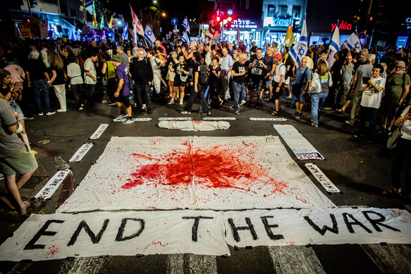 Israeli protesters gather around an anti-war installation with fake blood during a demonstration. Parents of Israeli combat soldiers marched from the military headquarters to Likud headquarters, demanding an immediate end to the Gaza war. The protest followed a press conference in which Prime Minister Netanyahu and U.S. President Donald Trump announced a ceasefire and hostage-release deal. In response, Hamas said it would study the plan before issuing its reaction, while Trump gave the group three to four days to accept the proposal or face serious consequences.