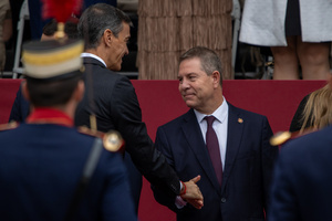 Emiliano García-Page, President of the Regional Government of Castilla-La Mancha greets Pedro Sánchez, Spanish President as he attends the parade. During the Armed Forces parade on National Day led by King Felipe VI, Queen Letizia, their daughters Leonor de Borbón, Princess of Asturias and Infanta Sofía de Borbón.