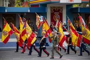 Representatives of various branches of the Spanish Army carry Spanish flags seen during the parade. During the Armed Forces parade on National Day led by King Felipe VI, Queen Letizia, their daughters Leonor de Borbón, Princess of Asturias and Infanta Sofía de Borbón.