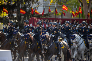 A representation of the National Police mounted on horseback marches. During the Armed Forces parade on National Day led by King Felipe VI, Queen Letizia, their daughters Leonor de Borbón, Princess of Asturias and Infanta Sofía de Borbón.