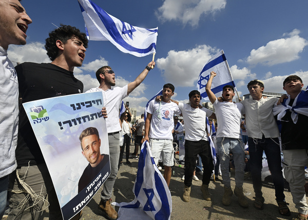 Friends and supporters of the hostage Avinatan Or dance while holding his picture and waving the Israeli flags. Avinatan, who was released after two years in Hamas captivity, was freed as part of President Trump’s deal to end the war. The people of Israel celebrated the release of the hostages after two years in Hamas captivity, marking the end of the war. Crowds gathered at hospitals to welcome the final hostages returning home, as the nation danced and rejoiced in relief and happiness.