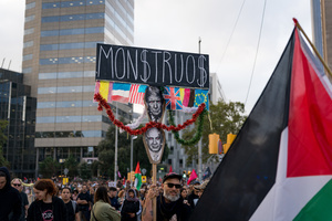 Pro-Palestinian protesters march with placards and waving Palestinian flags during the demonstration. A nationwide strike was held all over Spain, with demonstration in all the main cities. More than 20.000 of pro-Palestinian protesters marched in Barcelona, with several clashes with police and episodes of looting and burning of dumpsters.