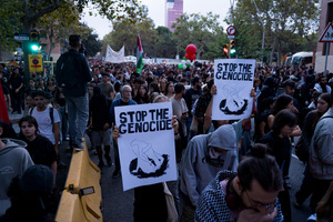 Pro-Palestinian protesters march and chant while holding placards and Palestinian flags during the demonstration. A nationwide strike was held all over Spain, with demonstration in all the main cities. More than 20.000 of pro-Palestinian protesters marched in Barcelona, with several clashes with police and episodes of looting and burning of dumpsters.