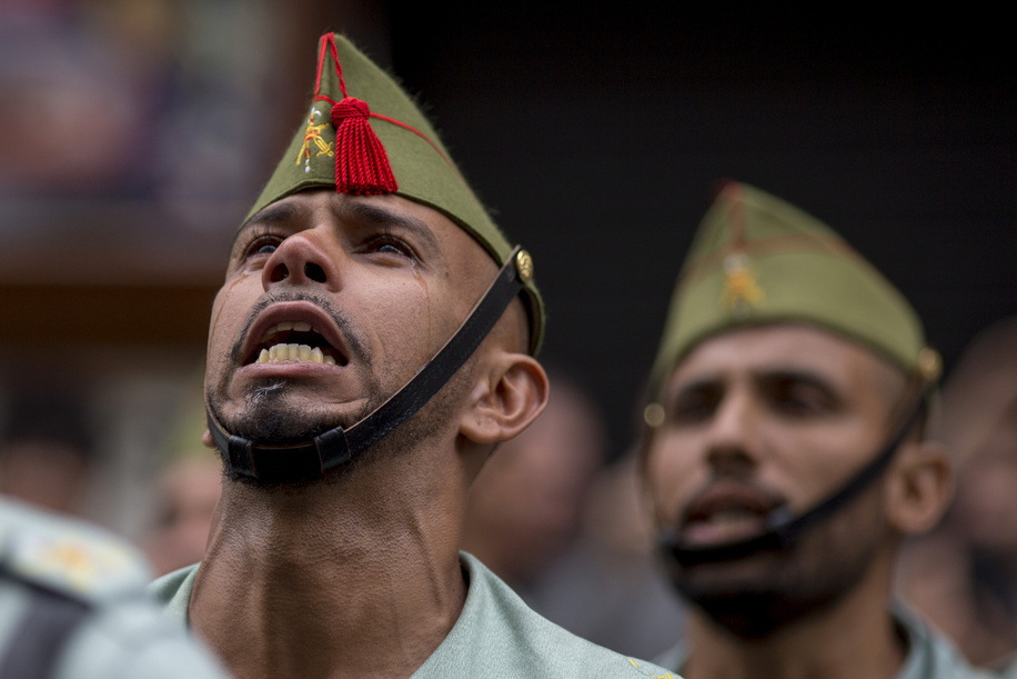 A member of La Legion, the elite forces of the Spanish army cries while singing the song “El Novio de La Muerte” the anthem of the elite group during a military parade on the Spain's National Day which commemorates the arrival of Christopher Columbus to the New World in 1492.