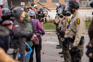 Police face off against demonstrators in front of the Broadview Immigration Detention Facility. A lawsuit filed October 30, 2025 alleges inhumane, degrading, and humiliating conditions in the facility with a lack of food, water, access to hygiene and medical care, or places to sleep.