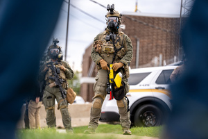 Police face off against demonstrators in front of the Broadview Immigration Detention Facility. A lawsuit filed October 30, 2025 alleges inhumane, degrading, and humiliating conditions in the facility with a lack of food, water, access to hygiene and medical care, or places to sleep.