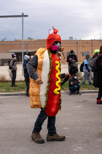 A demonstrator dances in front of the Broadview Immigration Detention Facility. A lawsuit filed October 30, 2025 alleges inhumane, degrading, and humiliating conditions in the facility with a lack of food, water, access to hygiene and medical care, or places to sleep.