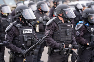 Police face off against demonstrators in front of the Broadview Immigration Detention Facility. A lawsuit filed October 30, 2025 alleges inhumane, degrading, and humiliating conditions in the facility with a lack of food, water, access to hygiene and medical care, or places to sleep.