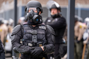 Police face off against demonstrators in front of the Broadview Immigration Detention Facility. A lawsuit filed October 30, 2025 alleges inhumane, degrading, and humiliating conditions in the facility with a lack of food, water, access to hygiene and medical care, or places to sleep.