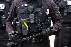 Police face off against demonstrators in front of the Broadview Immigration Detention Facility. A lawsuit filed October 30, 2025 alleges inhumane, degrading, and humiliating conditions in the facility with a lack of food, water, access to hygiene and medical care, or places to sleep.