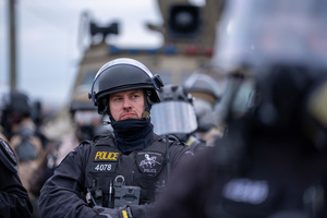 Police face off against demonstrators in front of the Broadview Immigration Detention Facility. A lawsuit filed October 30, 2025 alleges inhumane, degrading, and humiliating conditions in the facility with a lack of food, water, access to hygiene and medical care, or places to sleep.