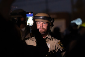 Police face off against demonstrators in front of the Broadview Immigration Detention Facility. A lawsuit filed October 30, 2025 alleges inhumane, degrading, and humiliating conditions in the facility with a lack of food, water, access to hygiene and medical care, or places to sleep.