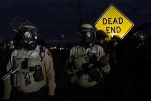 Police face off against demonstrators in front of the Broadview Immigration Detention Facility. A lawsuit filed October 30, 2025 alleges inhumane, degrading, and humiliating conditions in the facility with a lack of food, water, access to hygiene and medical care, or places to sleep.