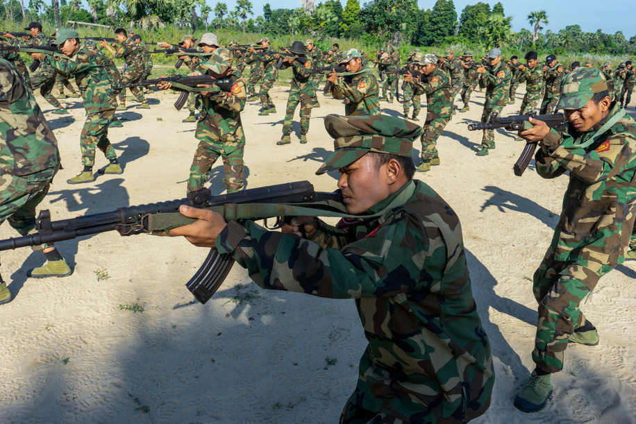 Soldiers from Battalion 12 in Shwe Bo District train with live firearms during a military exercise. The People's Defence Force (PDF) operates under the Ministry of Defence of the National Unity Government (NUG), a rival government. As of May 2025, the NUG claims to have formed over 300 PDF battalions.