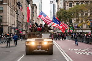 Veterans of the United States Armed Forces ride in a HUMVEE during the 106th annual Veterans Day Parade.