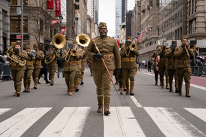 People dressed in American World War I uniforms march during the 106th annual Veterans Day Parade.