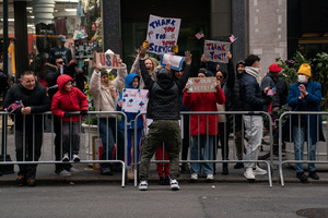 Spectators cheer on veterans as they march during the 106th annual Veterans Day Parade.