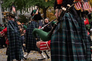 FDNY Commissioner Robert Tucker applauds members of the New York City Fire Department Emerald Society Pipes and Drums as they march during the 106th annual Veterans Day Parade.