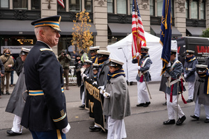 A colonel of the U.S. Army leads cadets during the 106th annual Veterans Day Parade.