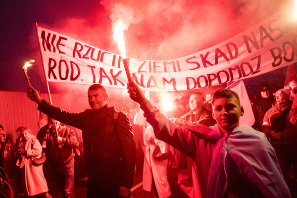 Participants hold burning flares during the demonstration. Thousands of Polish citizens marched through the streets of Warsaw to celebrate Independence Day, with an estimated 100,000 participants, including families and children. The march, which featured strong patriotic and religious symbolism, was initiated by far-right groups and has long been controversial for promoting extremist ideologies such as fascism, antisemitism, and racism. This year’s event, which began at Warsaw's Roman Dmowski Roundabout and ended at the PGE National Stadium, drew further attention as Polish MEP Dominik Tarczynski invited British far-right activist Tommy Robinson and his supporters to attend.