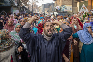 Kashmiri people mourn near the dead body of Muhammad Shafi, a civilian killed in an explosion inside a police station, during his funeral procession in Srinagar. Nine people were killed and 32 others were injured in a major explosion inside a Police Station. Explosives reportedly detonated during a forensic investigation as part of a probe into an earlier blast in India’s capital, New Delhi, that killed 13 people and injured dozens.