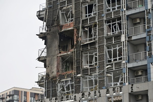 A damaged apartment building hit by a Russian drone strike amid Russia's attack.