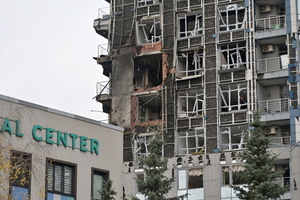 A damaged apartment building hit by a Russian drone strike amid Russia's attack.