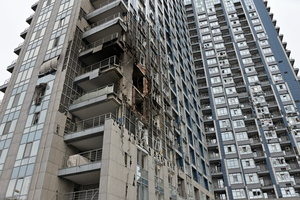 A damaged apartment building hit by a Russian drone strike amid Russia's attack.