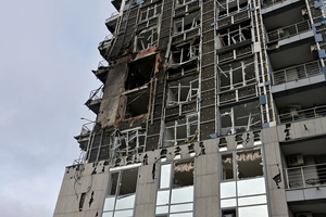A damaged apartment building hit by a Russian drone strike amid Russia's attack.
