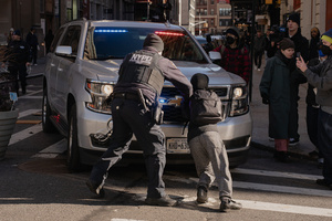NYPD clear protestors that confronted Immigration and Customs Enforcement (ICE) agents before an the streets as attempted sweep on Canal Street in Manhattan. ICE has cracked down on vendors selling counterfit goods in New York City.