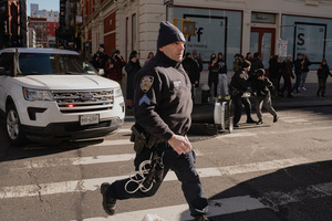 NYPD clear protestors that confronted Immigration and Customs Enforcement (ICE) agents before an the streets as attempted sweep on Canal Street in Manhattan. ICE has cracked down on vendors selling counterfit goods in New York City.