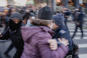 NYPD clear protestors that confronted Immigration and Customs Enforcement (ICE) agents before an the streets as attempted sweep on Canal Street in Manhattan. ICE has cracked down on vendors selling counterfit goods in New York City.